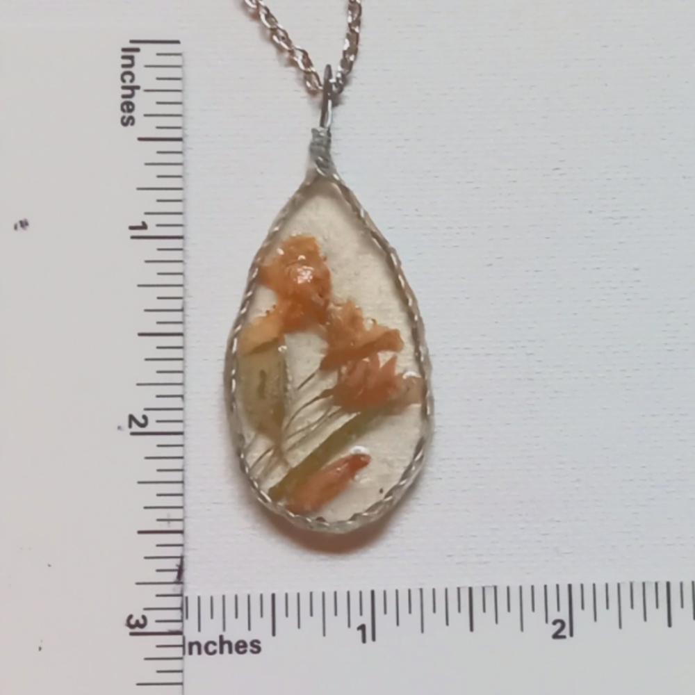 Floral necklace, amulet